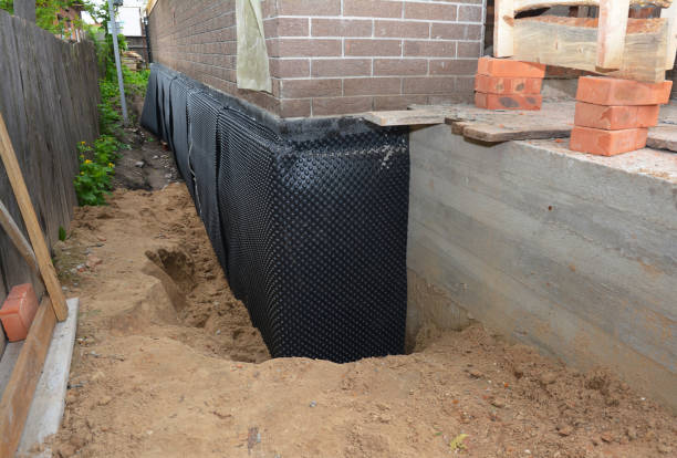 Happy homeowners after waterproofing job in Nunica